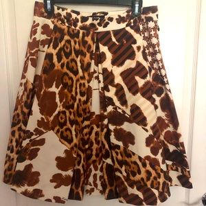 Pleated front a-line skirt with side zipper.